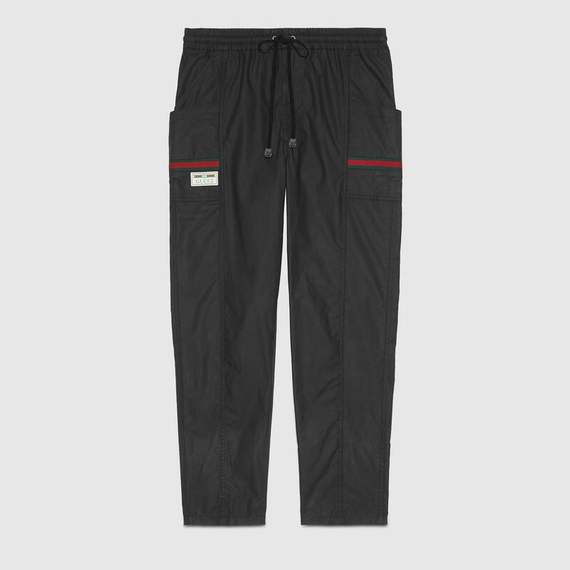 Click to view more detailed imagery on our partner's website Gucci Coated Cotton Trousers With Label In Black